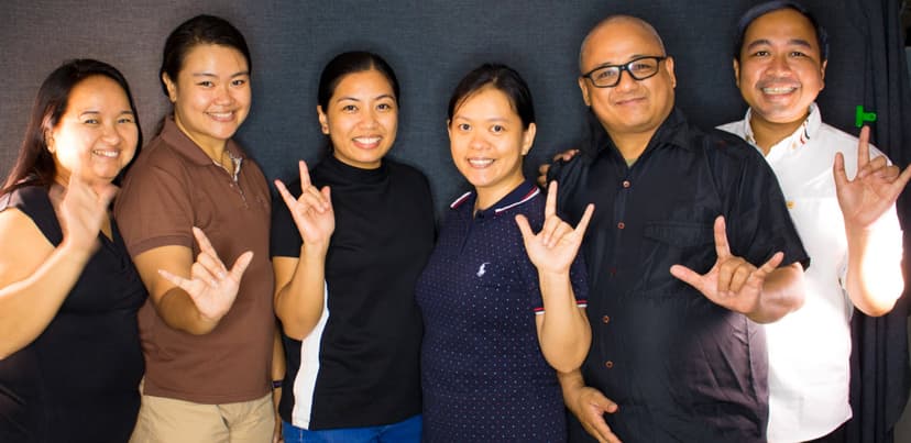 TulaySenyas team of 6 members showing the ILY (I Love You) handshape in Filipino Sign Language